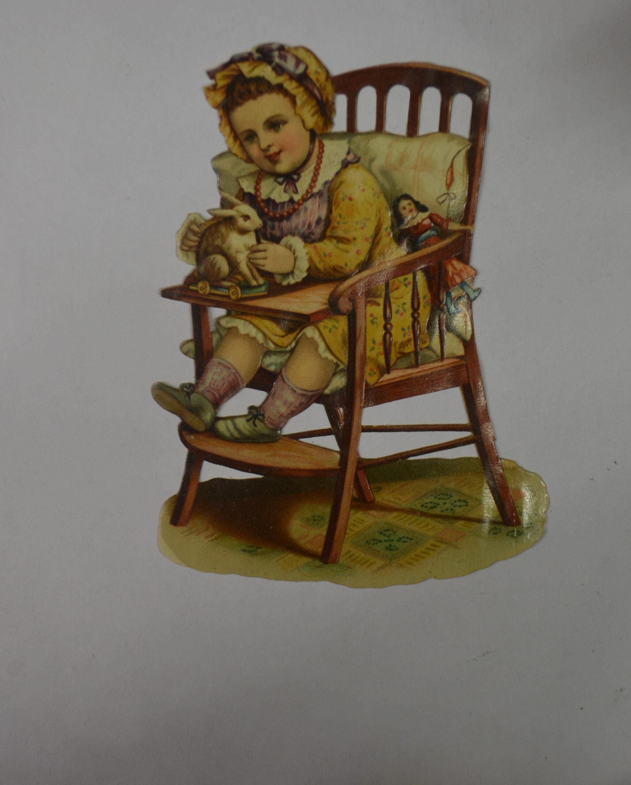 Tlačený reklamní obrázek - Děti - Dívka ve stoličce s hračkama - Velikost cca 15x10 cm